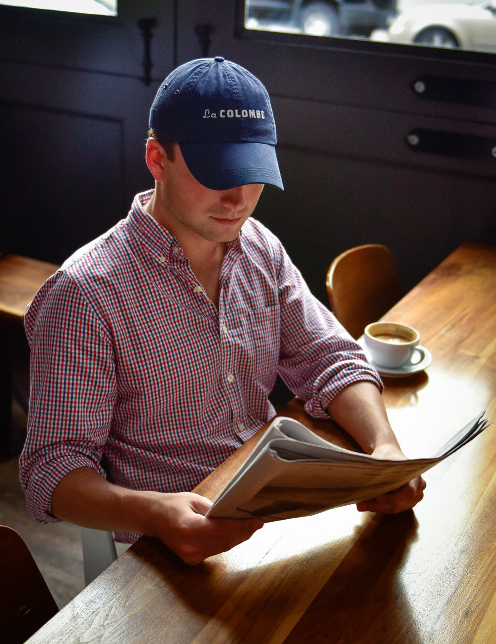 Another shot of someone wearing a La Colombe Baseball Cap.